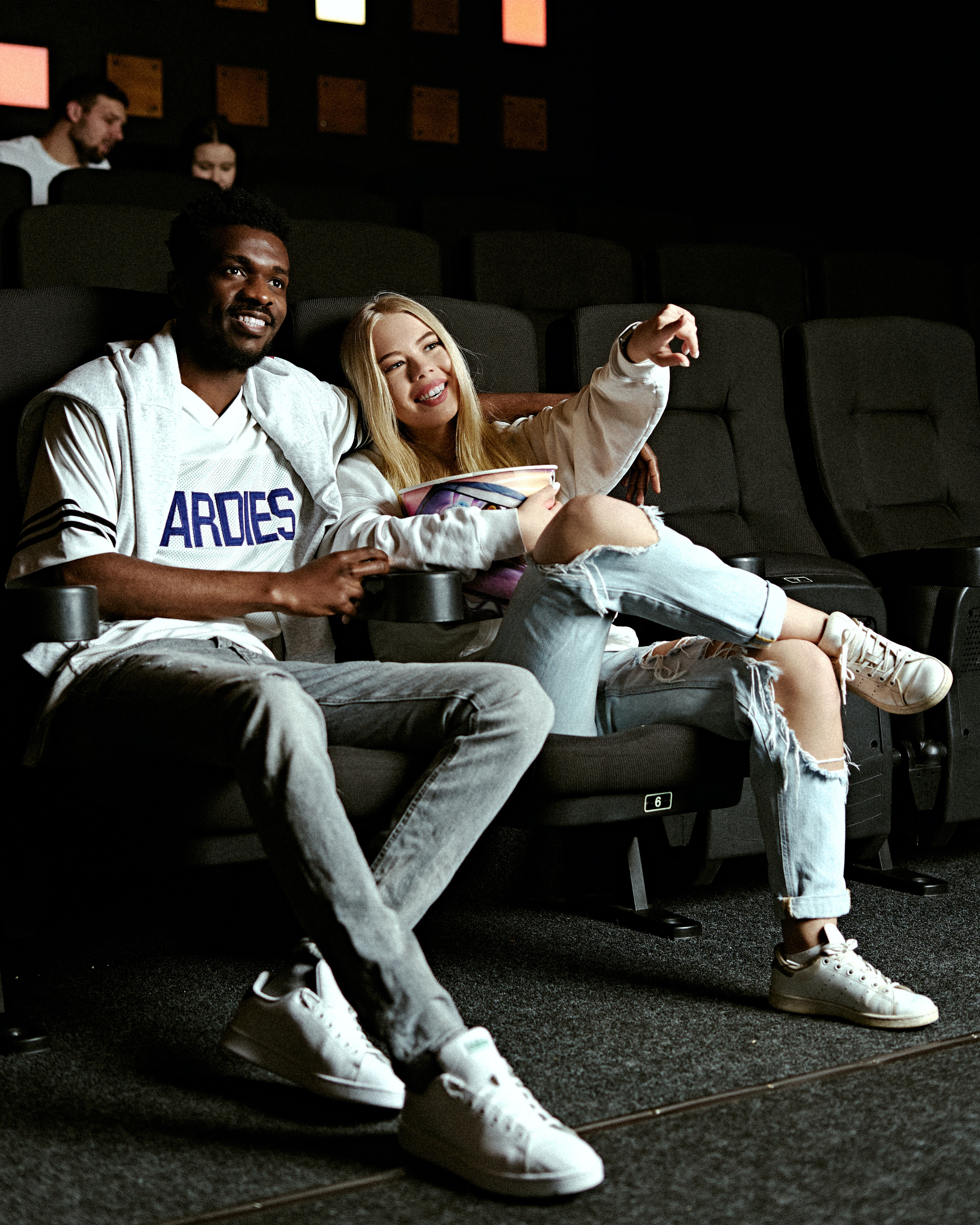 photo of friends watching a movie/series